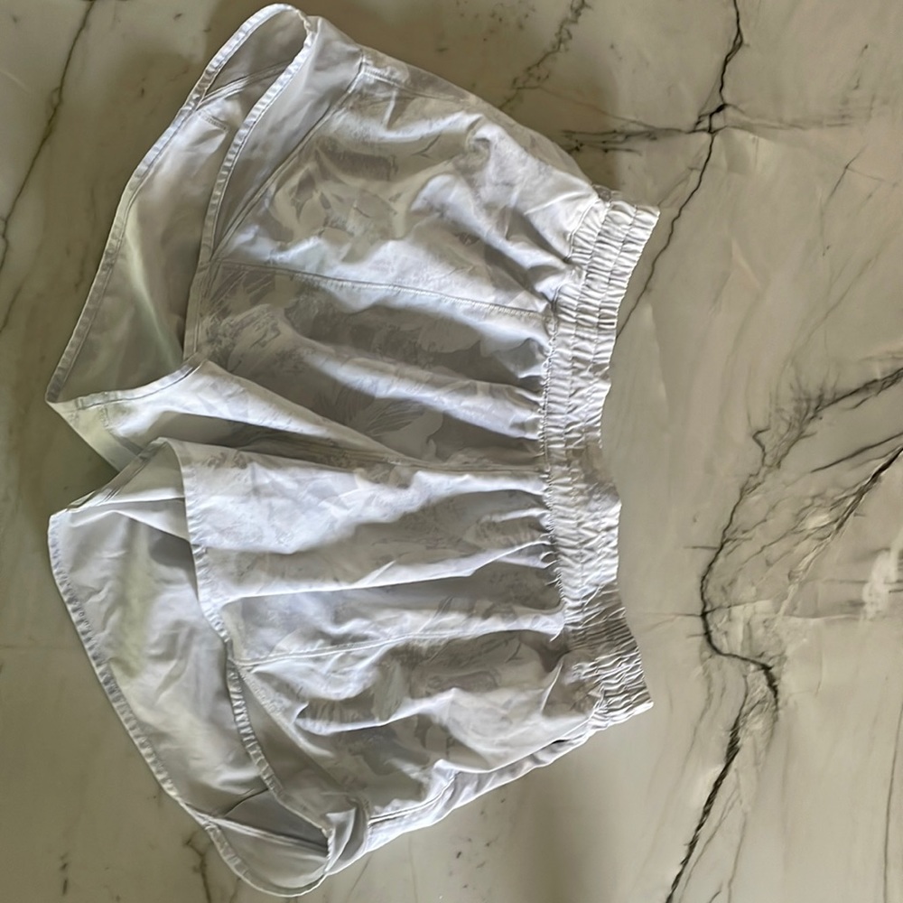 Cloudy white lululemon hotty hot 4 inch shorts